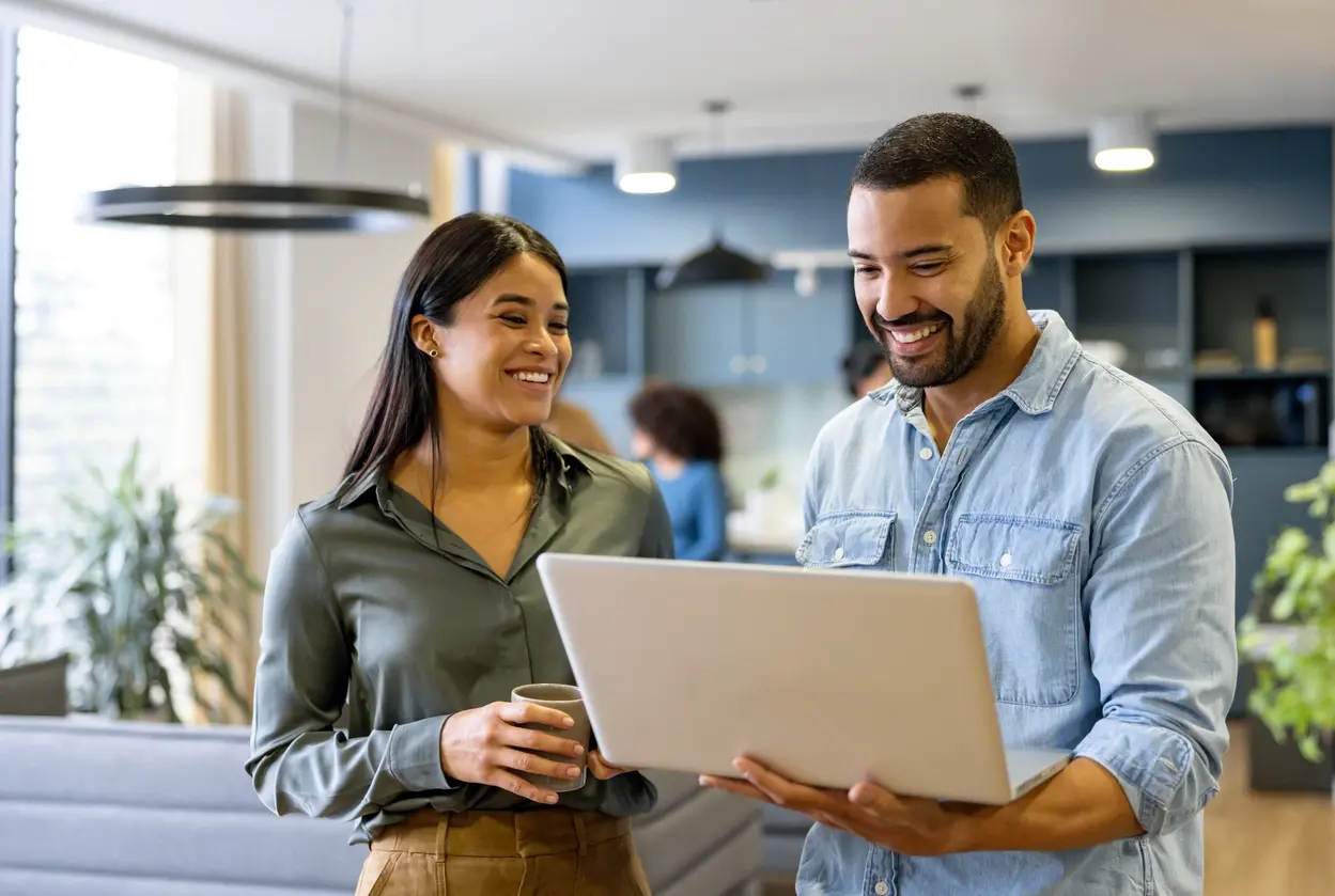A man and woman with a laptop
