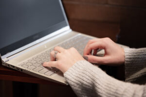 detailed view of hands on a keyboard