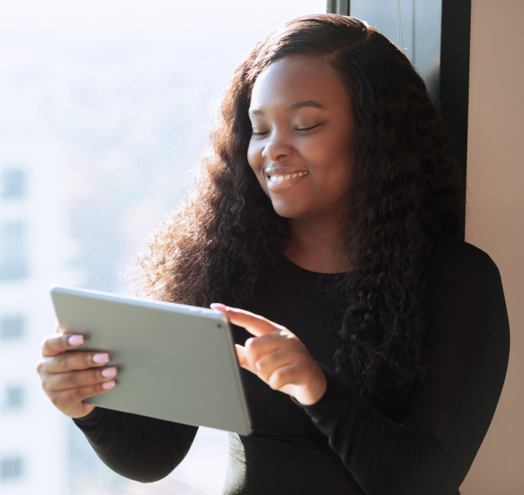 young African American woman looking at tablet