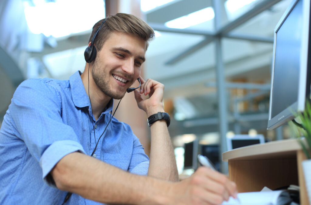 smiling, friendly, handsome, young male call center operator