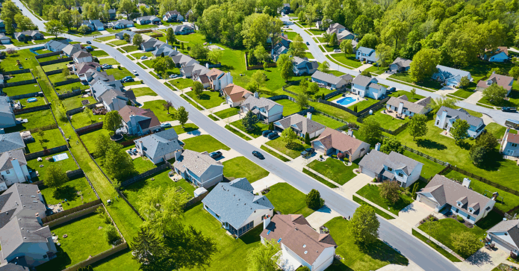 Neighborhood of many houses with varying colored roofs